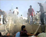 Palestinians search for survivors after an air strike in Gaza City