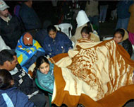 Relatives sit through the nightawaiting news of the miners