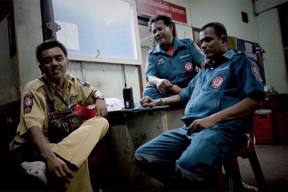 9:49pm: An emergency team chats at its base before beginning the night shift.