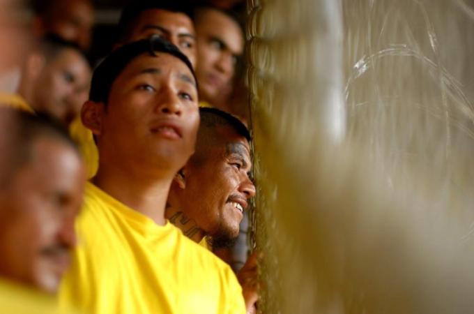 Members of the gang Mara 18 stand in a prison in Izalco