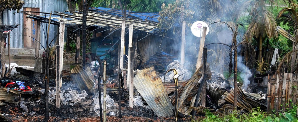 Fighting between Bodo tribespeople and Muslims rocked India(***)s northeastern Assam state in late July. Here, a house burns in the Serfhngguri village in Kokrajhar district.
