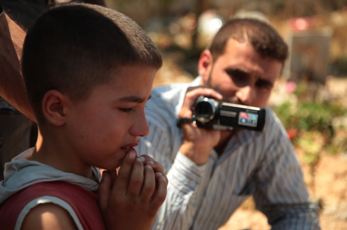 Filing at FSA media centre [Richard Hall/Al Jazeera]