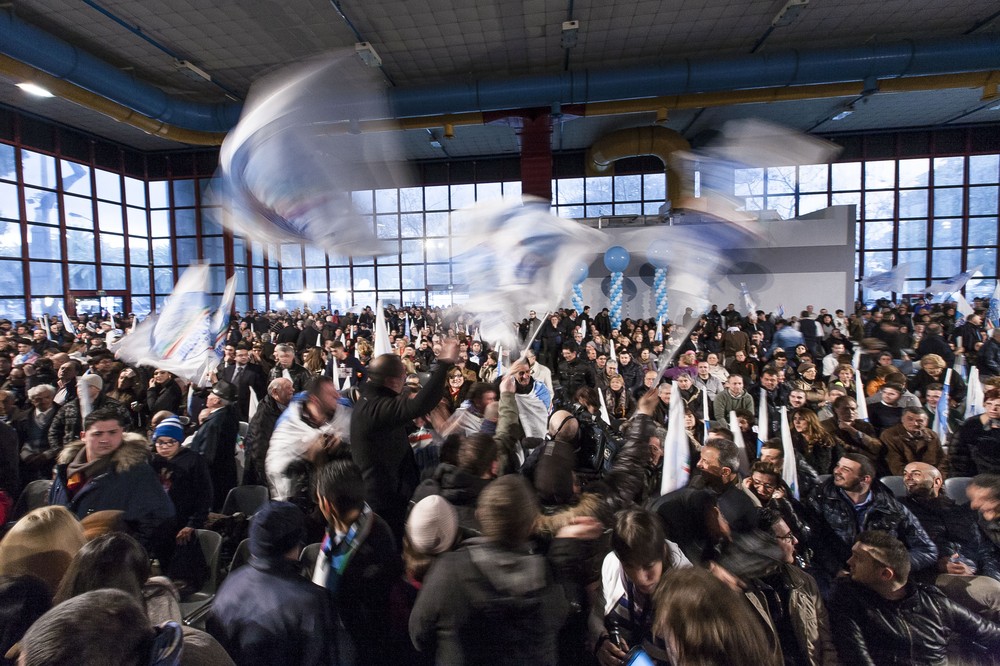 People wave flags, gesture and chant slogans in support of Silvio Berlusconi(***)s centre-right People of Freedom (PDL) party during its final rally before a ban on campaigning ahead of the vote. Italians cast their ballots on Sunday and Monday.