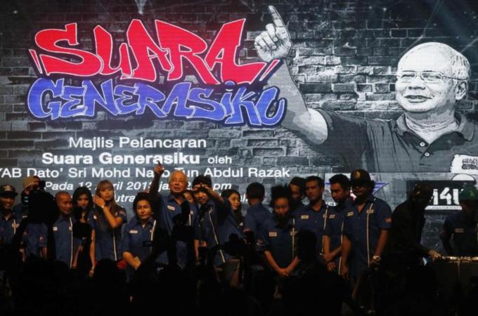 Malaysia''s Prime Minister Najib Razak talks to youngsters after he launched the