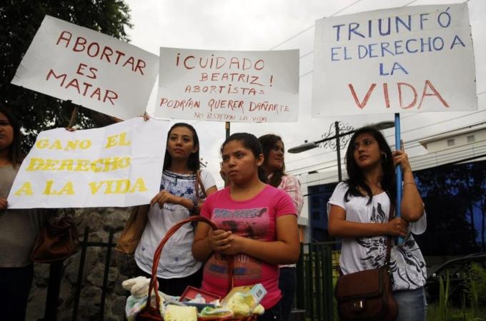 Anti-abortionists hold placards during a protest at the