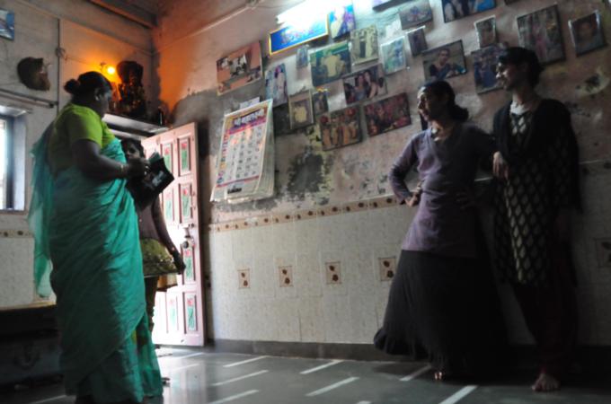 Zeenath Pasha at her brothel in Ramabai chawl. Her adopted daughter lives with her, and goes to a school in the neighbourhood. [Chinki Sinha/Al Jazeera]