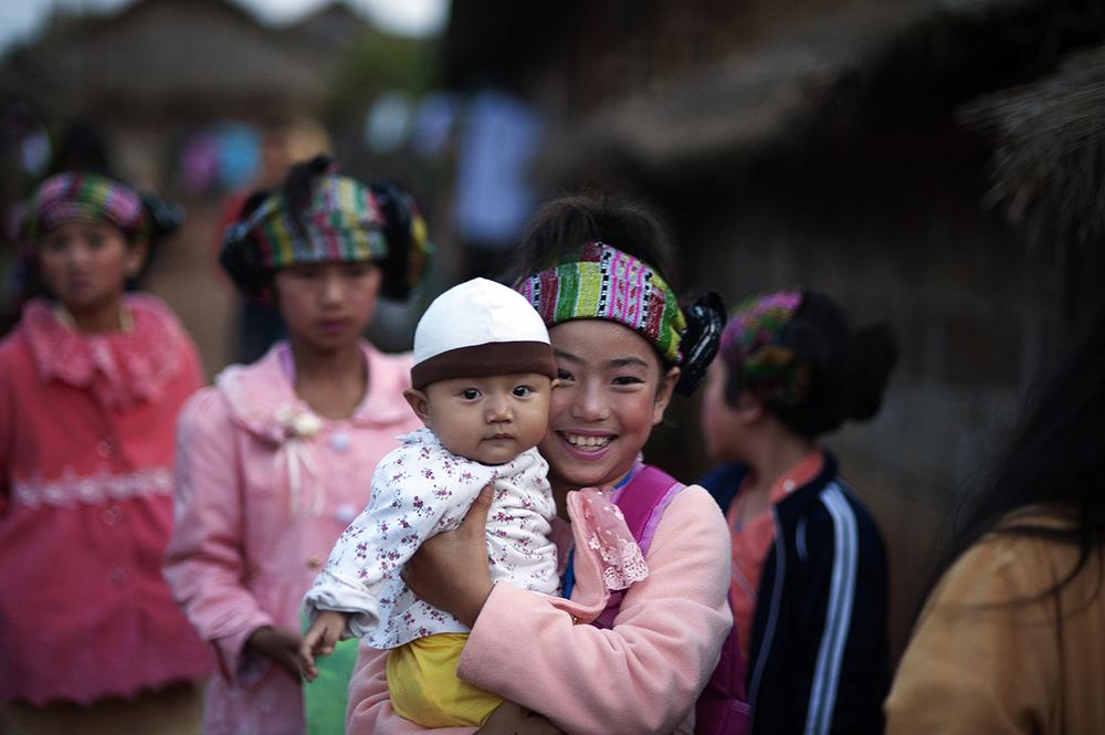 Teenagers wear traditional clothes during Shan New Year in Koung Jor Shan Refugee Camp, Thailand.