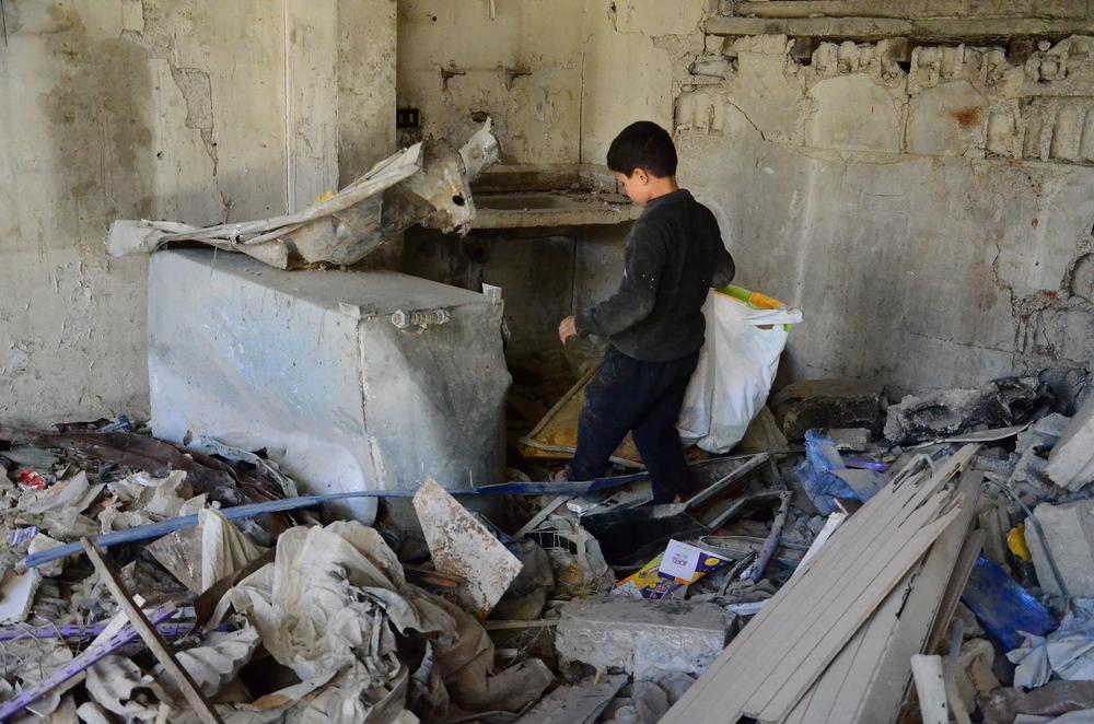 Ten-year-old Mohammed dropped out from school to work and help his parents and three younger siblings. Every day, the young boy roams the streets collecting wooden doors and furniture from shelled houses as well as material like nylon. Mohammed also collects metal or anything that seems valuable and sells it for extra money.