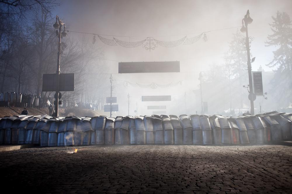 Clashes with riot police started in Kiev early on Tuesday morning, after thousands of protesters marched towards parliament.