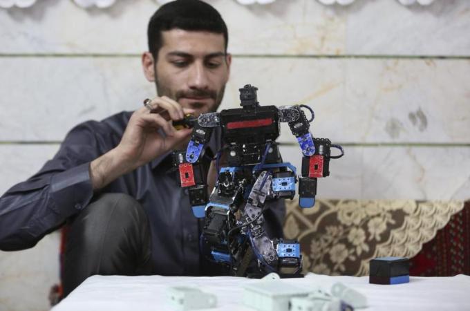 Iran's government estimates that '150,000 highly talented people' leave each year [AP]