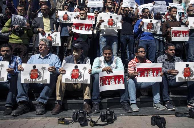 Journalists and photojournalists demonstrate in Cairo against repeated attacks on members of the press in Egypt [AFP]