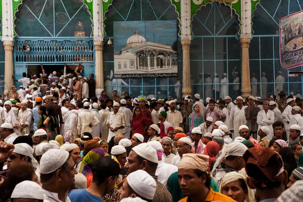 Thousands of pilgrims prepare to leave the Sufi shrine after offering prayers during the annual Urs festival.