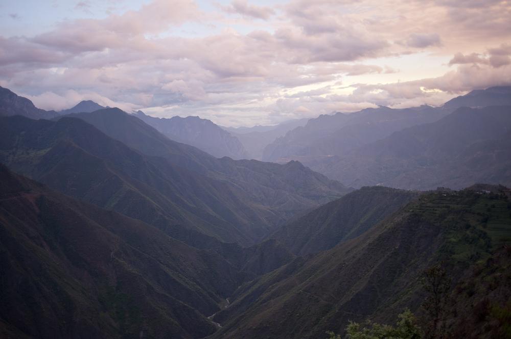 The scenery is spectacular on the road from Lijiang to Lake Lugu in China's Yunnan province. Domestic tourism is booming here, on the borders of Tibet, Vietnam, Burma and Laos. [Dave Tacon/Al Jazeera]