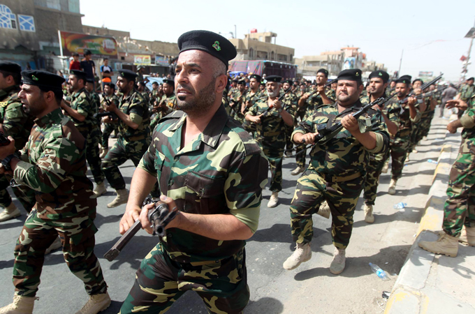 A recent military parade in Baghdad was another sign of the increasing militarisation of the capital [EPA]
