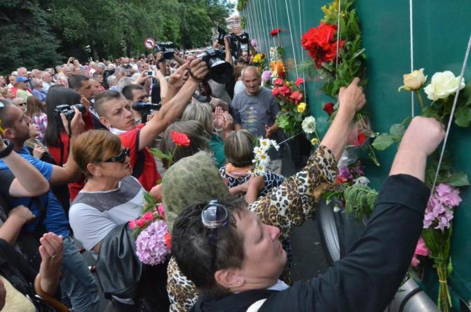 Trucks carrying the remains of 175 recently identified victims of the Srebrenica genocide passed through Sarajevo on July 9 [AFP/Getty Images]