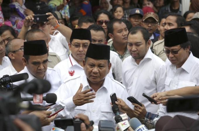 Prabowo Subianto has claimed victory in Indonesia's presidential elections [AP]