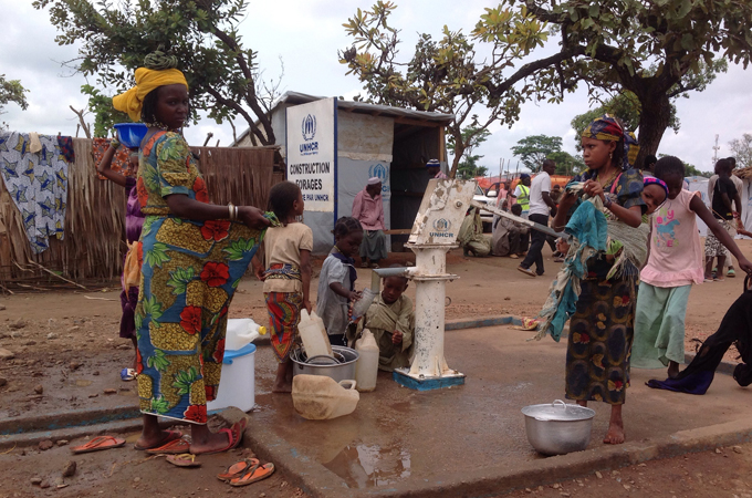 CAR refugees fetch water from a borehole at a camp in eastern Cameroon [Eugene Nforngwa/Al Jazeera]