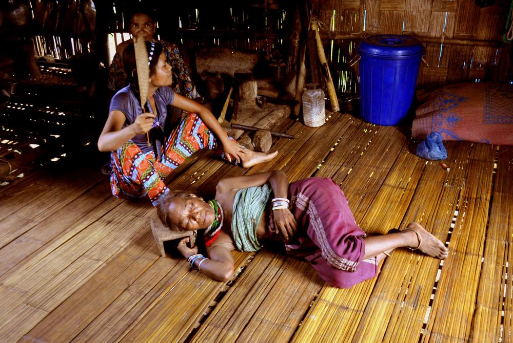 <p>A Bru (locally called Reang) woman diagnosed with malaria lies on the floor of her bamboo hut as her daughter fans her in the Ashapara camp in Kanchanpur in North Tripura district, 230km northeast of Agartala, the capital of Tripura state.</p>
