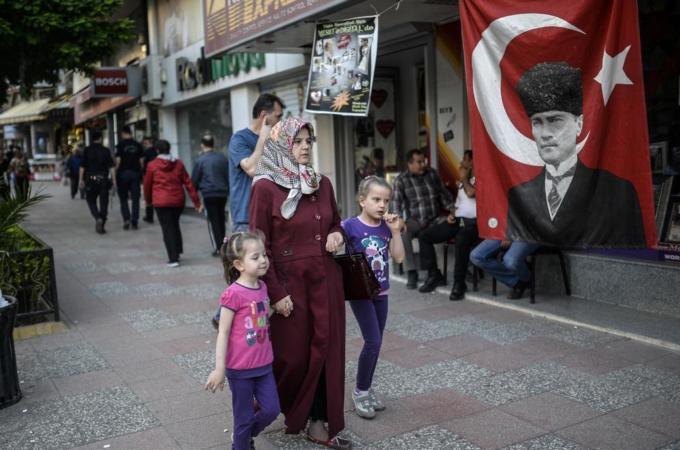 The lack of daycare centres forces some Turkish women to stay at home and take care of their children, writes Akyol [AFP]