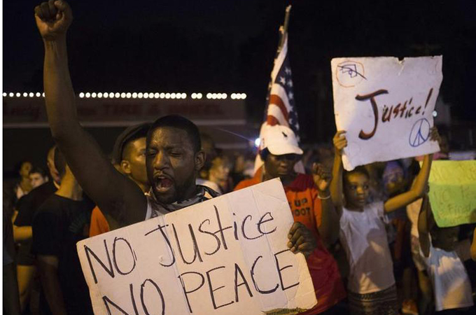 The image of a peaceful American heartland devoid of racism has been put to rest, writes Johnson [Reuters]