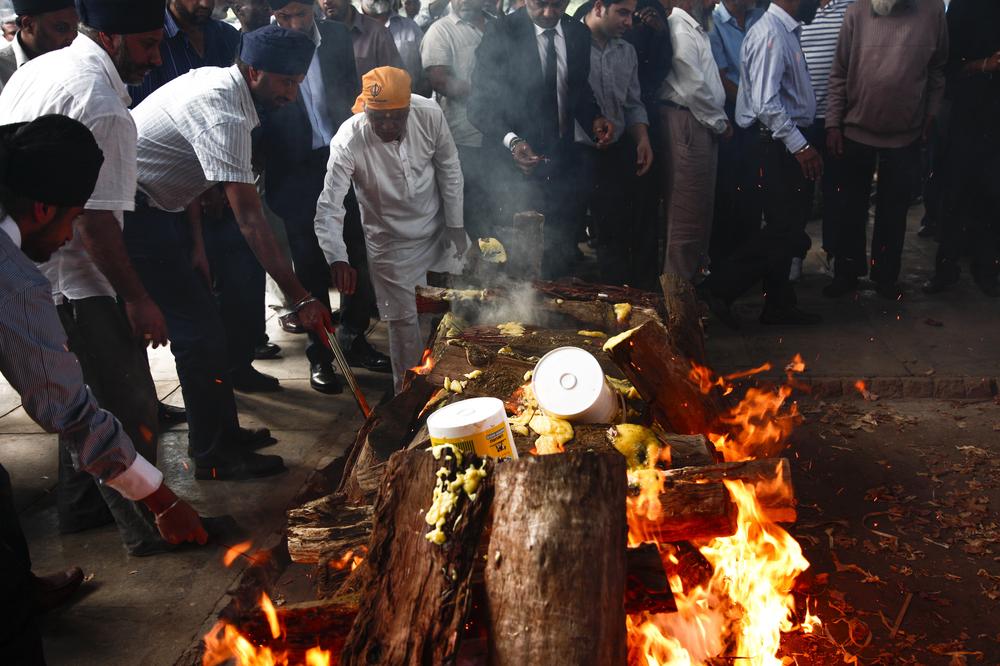 <p>On September 25, 2013, Ambi Ghataure and his father, Gurdial Ghataure, adhere to the traditional Sikh customs and cremate Pablo Ghataure and Davinder Ghataure, at the Sikh crematorium in Nairobi, Kenya. Pablo was Ambi(***)s son and Gurdial(***)s grandson, and Davinder was Ambi(***)s mother and Gurdial(***)s wife. Pablo and his grandmother(***)s cremations are among the first funeral rites of the 67 dead to be laid to rest as the siege at Westgate officially enters its fifth day. The KDF claim that they had all but defeated the terrorists, but sporadic bursts of gunfire could still be heard echoing through Westgate and across the by then expanded scene.</p><p>Pablo and his grandmother had been at the cooking competition on the rooftop when the attack happened. It was believed that they were among the first fatalities. The family are still not entirely sure how everything happened.</p><p>The cremations were one of the most difficult parts of the story to photograph at that time. They are personal, and intimate, an ancient passage of rite in devastating circumstances. This was the fist time since the first day inside Westgate that I felt connected to the story again. All that had happened in the interim was a dictated course of action by the authorities in charge to mediate and stifle the flow of information and access to the truth and what was happening. The security cordon was moved further and further away from the building over the course of the three days. Some of the other photographers used long lenses to try to capture what little they could of what was happening outside. The focus then, during the siege, was on what had transpired inside Westgate, and how, and by whom - but none of those questions were ever fully answered, and it remains that way. The cremations defied everything the authorities had set about to do like withholding identities and information of people who were killed, and laid bare the horrific and harrowing tragedy that had unfolded. I will never forget words that my dad once said to me: (***)No father should ever have to bury his son.(***) I could not imagine anyone having to do that, and there was Ambi, cremating his son and his mother.</p>