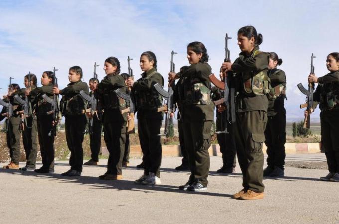 Kurdish female fighters of the Kurdish People's Protection Units (YPJ) at a military training camp. [Reuters]