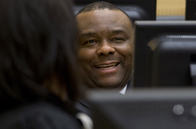 Jean-Pierre Bemba smiles at his trial at the International Criminal Court in The Hague in 2013 [Reuters]