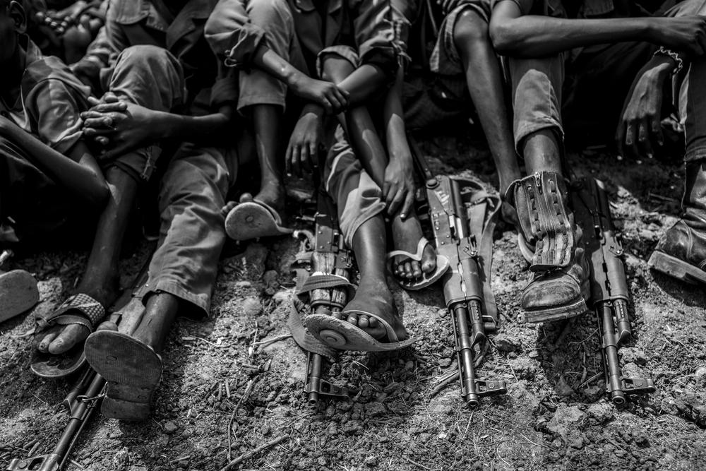 Child soldiers from the Cobra faction gather to be taken into the care of UNICEF in Pibou, South Sudan.