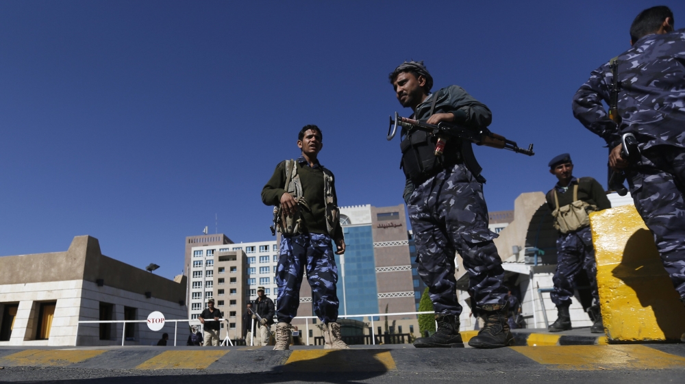 Police troopers secure the gate of a hotel hosting U.N.-sponsored negotiations on a political settlement for Yemen''s crisis, in Sanaa