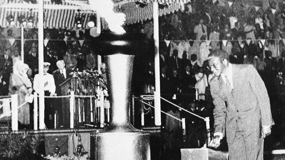 Then-Prime Minister Robert Mugabe of newly independent Zimbabwe lights the Independence Flame on April 18, 1980, a monument to Black majority rule [File: AP/Matt Franjola]