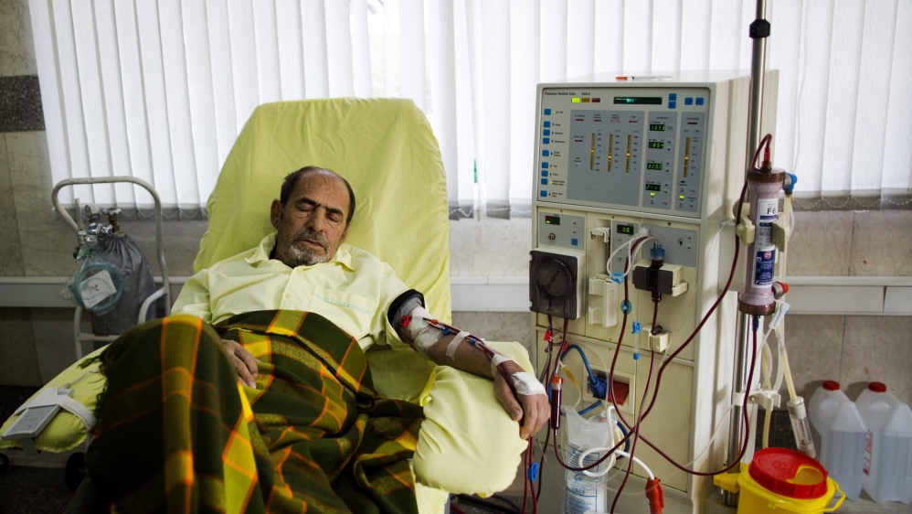 An Iranian kidney patient receives treatment at the dialysis ward at the Helal Iran Clinic in Tehran [AFP]