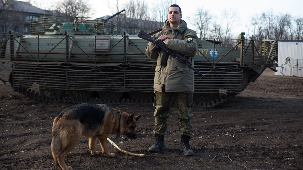 A fighter with the volunteer Azov Battalion at a base in Mariupol [John Wendle/Al Jazeera]