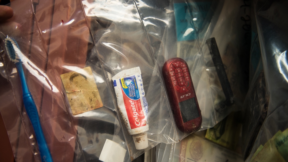 US law enforcement officers often rely on data from SIM cards to try and identify bodies [Felix Gaedtke/Al Jazeera]