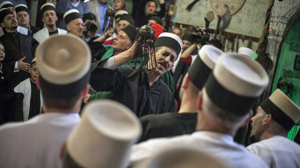 A devotee spinning the zarfs during the Nowruz ritual in Prizren, Kosovo [Ferdi Limani/Al Jazeera]