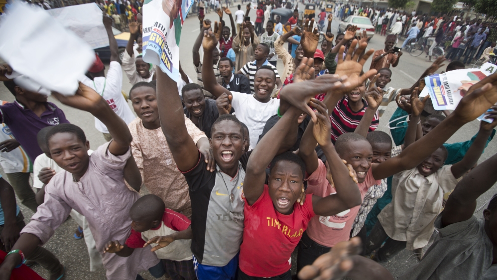 Supporters of Muhammadu Buhari celebrate [AP]