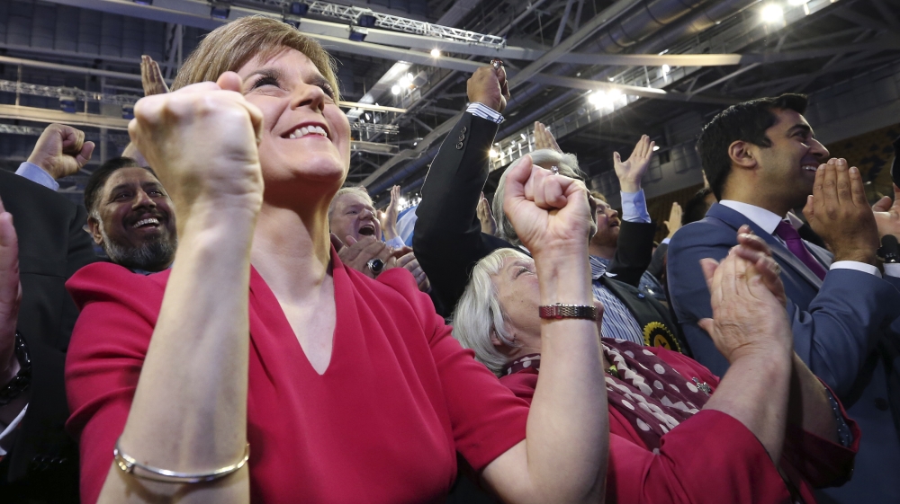 The SNP leader Nicola Sturgeon celebrates victory after the party made an unprecedented clean sweep of seats in Scotland [AP]