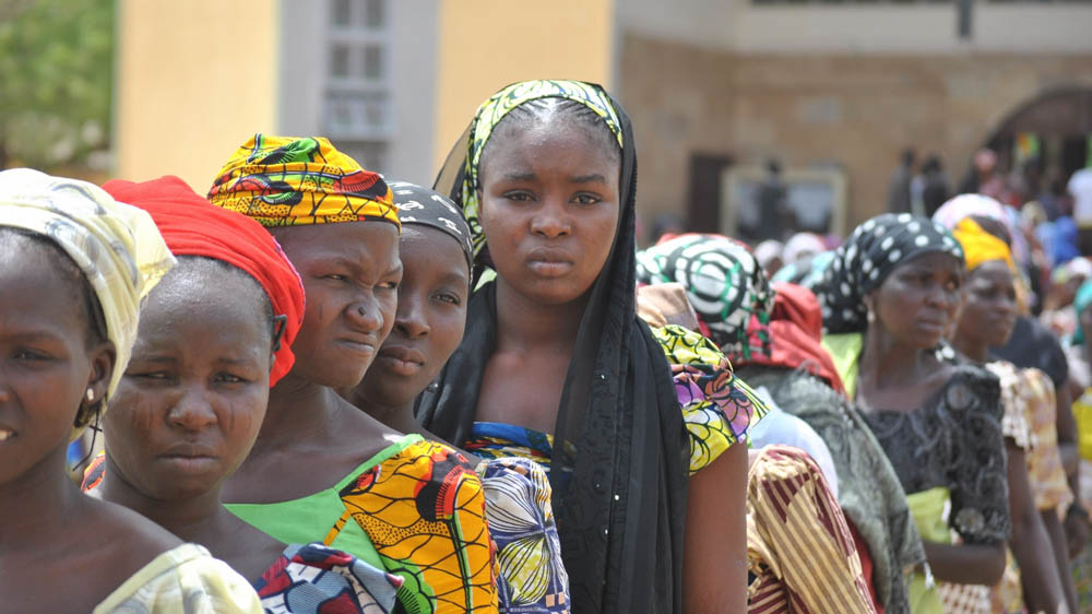 Most of these women walked all night to reach St Theresa to receive aid [Fragkiska Megaloudi/Al Jazeera]