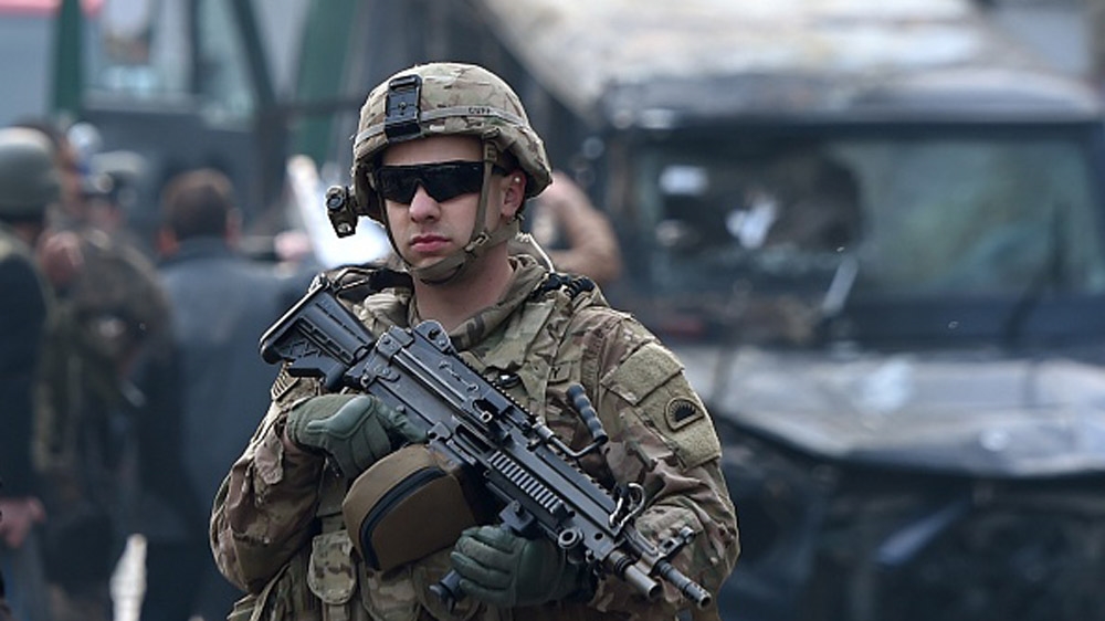 A US soldier keeps watch in front of the Iranian embassy in Kabul [AFP]