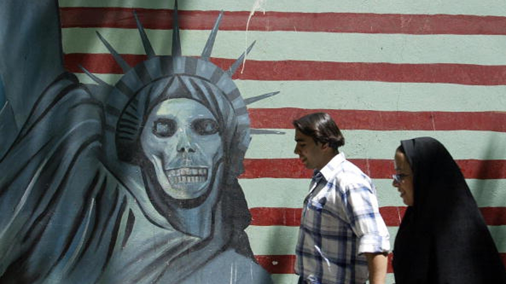 An anti-US mural painting outside the former US embassy in Tehran [AFP]