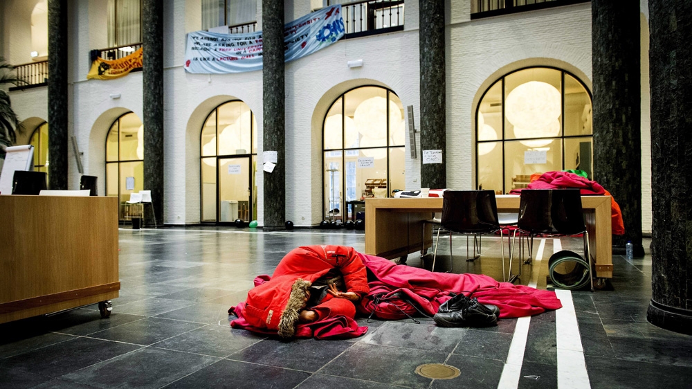 A student sleeping in the university's administrative centre, Maagdenhuis, in Amsterdam [EPA]