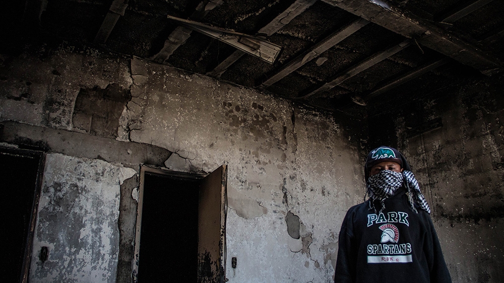 Labourers burned a police station in Vicente Guerrero during the unrest [José Pedro Martínez/Al Jazeera]