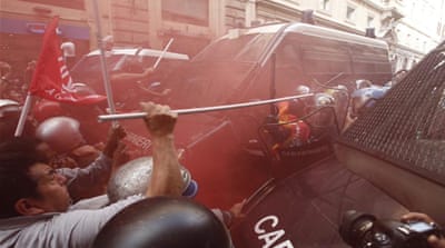 Protesters and riot police clash in central Rome [EPA]