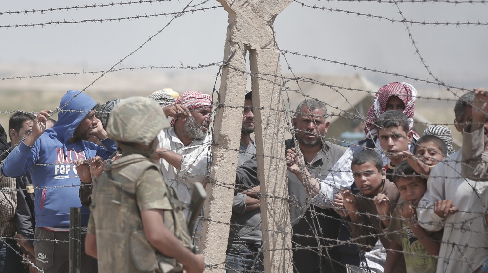 The flood of refugees has created chaos at times, with some cutting through the border fence in frustration at the delay in crossing [AP]