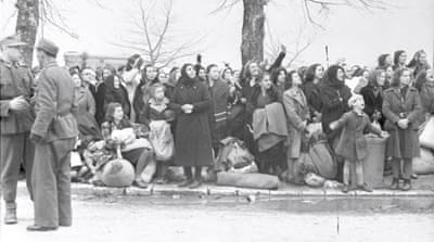 A group identified as Greek Jews in Ioannina, Greece, waiting to be taken to Nazi death camps in 1944 [EPA]