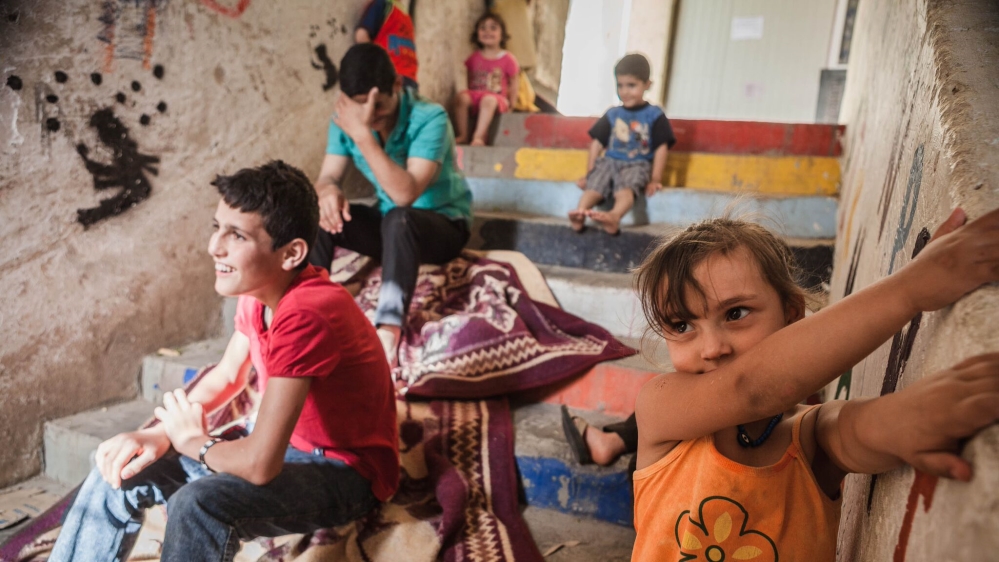 The project encourages children to paint together [Andrea DiCenzo/Al Jazeera]