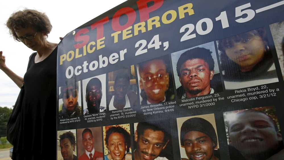 A protester demonstrates outside the funeral for Sandra Bland in Chicago as hundreds of others gathered in Newark [Reuters]