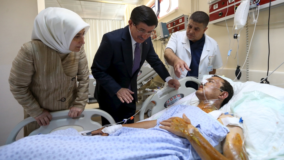 Turkey''s Prime Minister Ahmet Davutoglu, accompanied by his wife, visits a survivor who was wounded in Monday''s bomb attack in Suruc, in Sanliurfa
