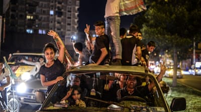 HDP supporters celebrate what they consider to be an AK party defeat [Getty]