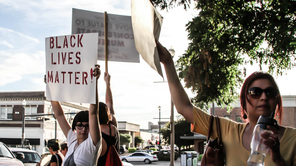 Many of the protesters expressed solidarity with the growing Black Lives Matter movement [ Shaghayegh Tajvidi /Al Jazeera]