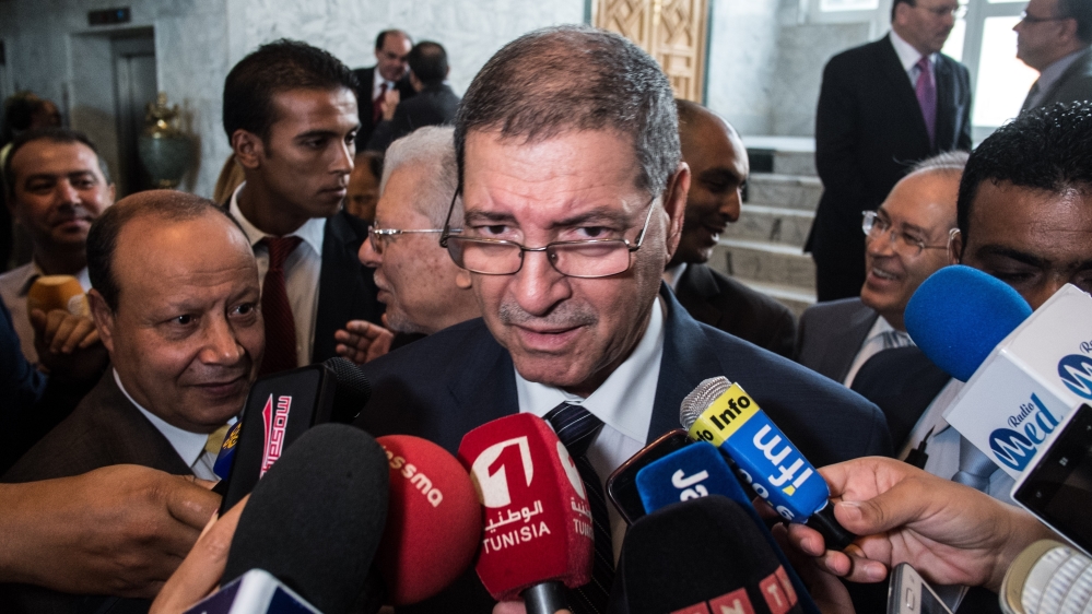 Tunisian Prime Minister Habib Essid attends a panel in Tunis